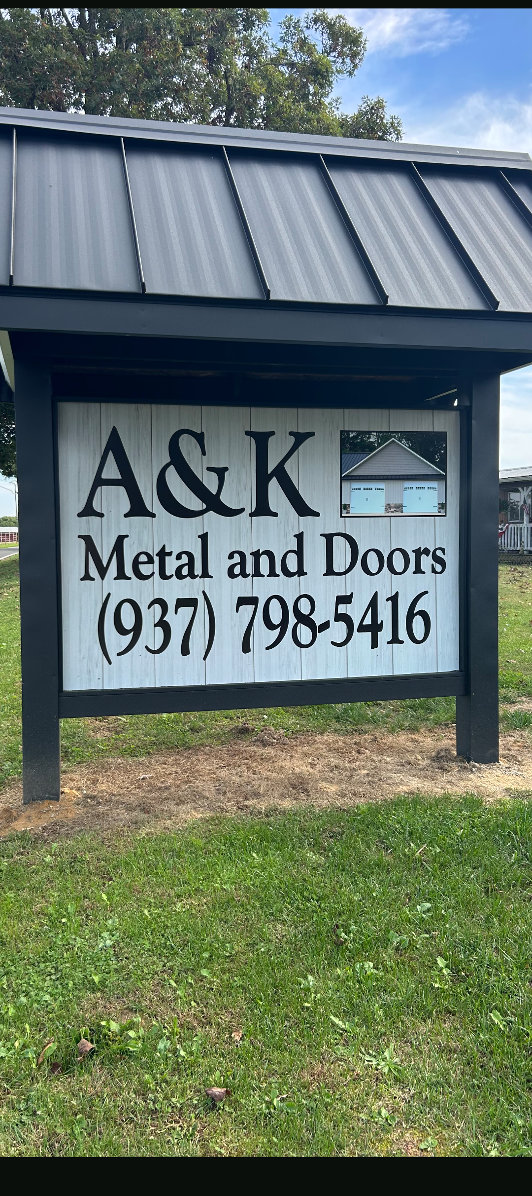 The A&K Metal and Doors sign at the showroom on Wheat Ridge Road in West Union, Ohio