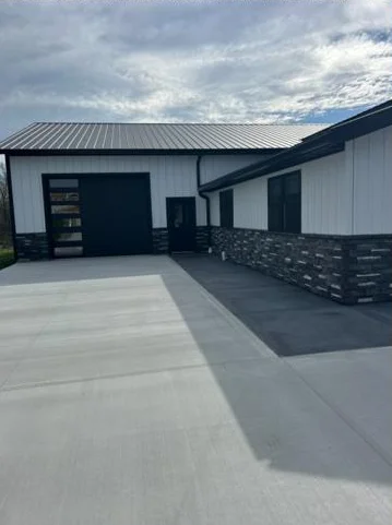 Metal roof, metal siding, and overhead door on a shop installed by A&K Metal and Doors in Southern Ohio